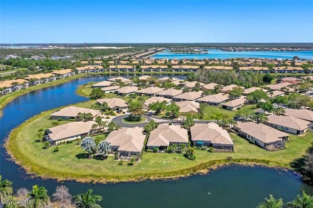 bird's eye view featuring a residential view and a water view