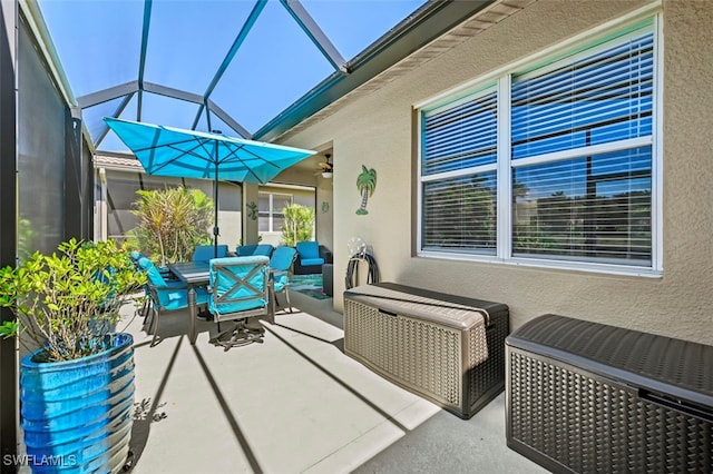 view of patio / terrace with a lanai and outdoor dining space