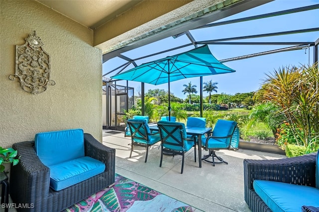 view of patio featuring outdoor lounge area, a lanai, and outdoor dining area