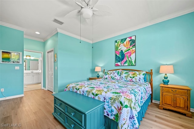 bedroom with visible vents, ornamental molding, baseboards, and wood finished floors