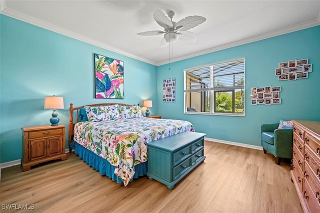 bedroom featuring ceiling fan, baseboards, crown molding, and light wood-style floors