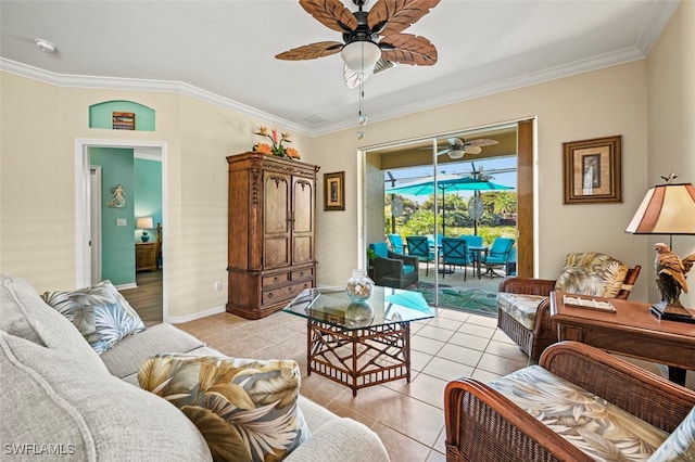 living room with light tile patterned flooring, a ceiling fan, and ornamental molding