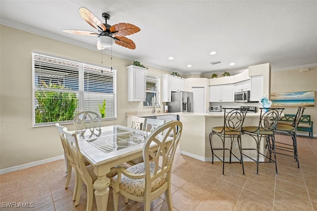 dining space featuring light tile patterned floors, a ceiling fan, baseboards, recessed lighting, and ornamental molding