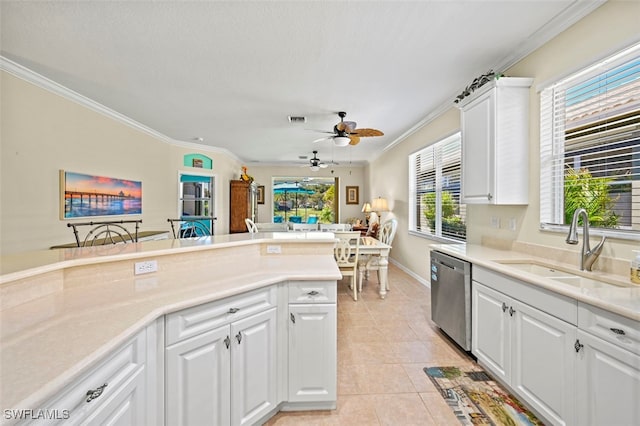 kitchen featuring visible vents, light tile patterned flooring, ornamental molding, a sink, and dishwasher