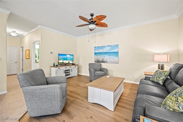 living area with light wood-style floors, a ceiling fan, crown molding, and baseboards