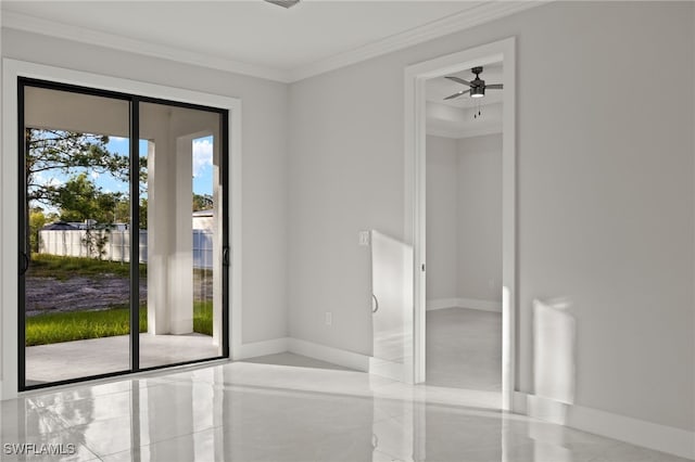 unfurnished room with baseboards and crown molding