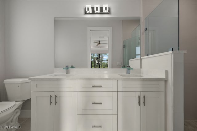 full bath featuring a sink, toilet, and double vanity