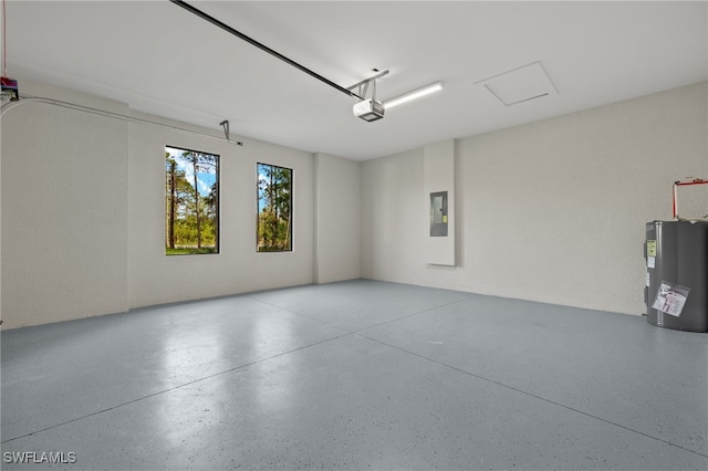 garage featuring a garage door opener, electric panel, and water heater