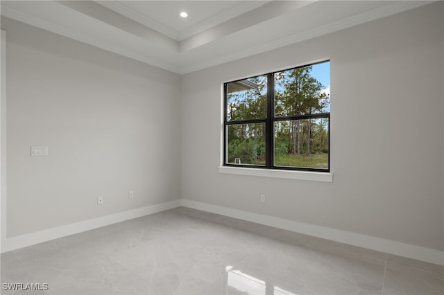 unfurnished room with ornamental molding, recessed lighting, a raised ceiling, and baseboards