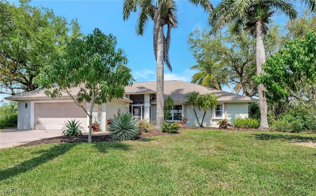 ranch-style house featuring a garage, driveway, a front lawn, and stucco siding