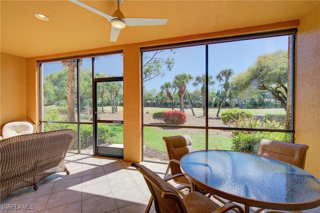 sunroom / solarium with ceiling fan