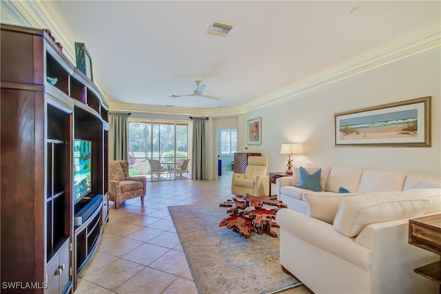 living area with light tile patterned floors, visible vents, ornamental molding, and ceiling fan