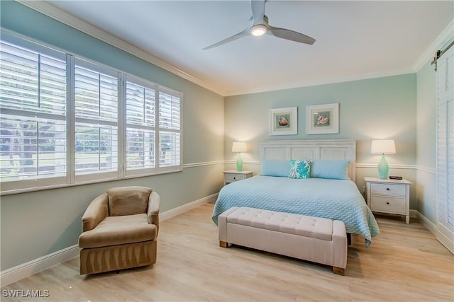 bedroom with ceiling fan, crown molding, baseboards, and wood finished floors