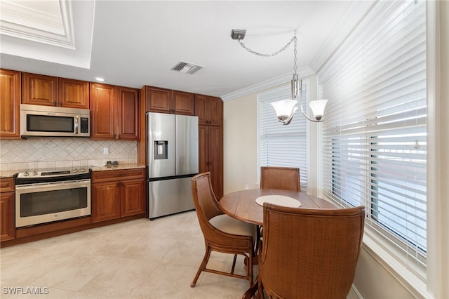 kitchen with brown cabinetry, visible vents, stainless steel appliances, and crown molding