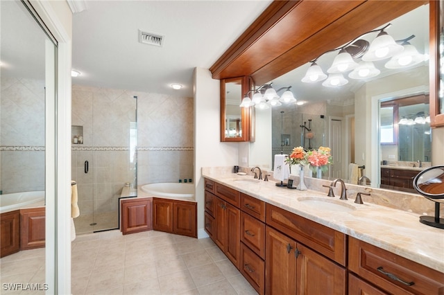 bathroom with a stall shower, double vanity, a sink, and a bath