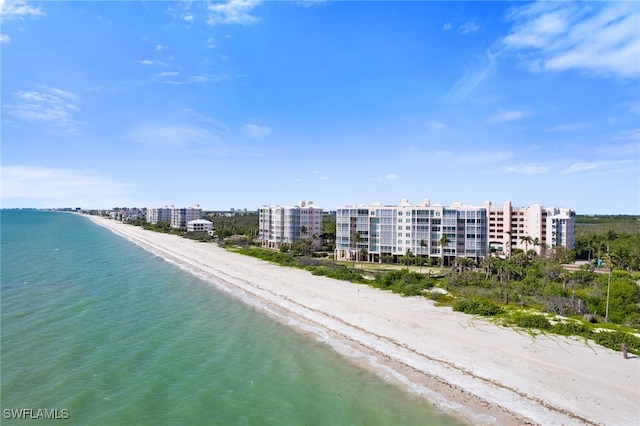 aerial view featuring a water view and a beach view