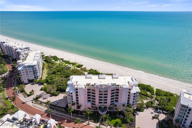 drone / aerial view featuring a view of the beach and a water view