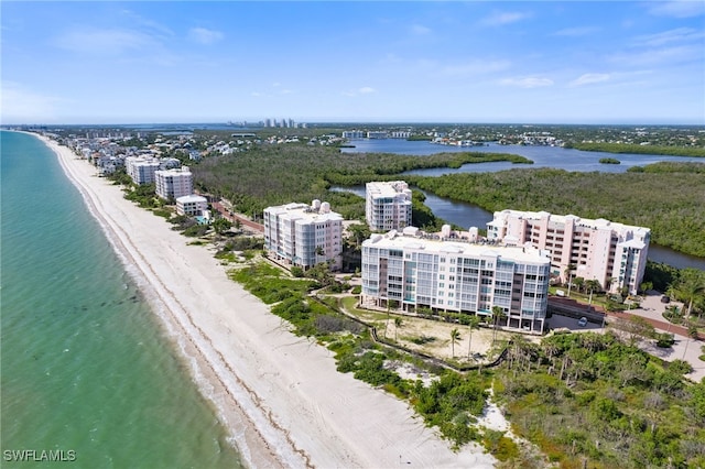 birds eye view of property featuring a city view, a water view, and a beach view