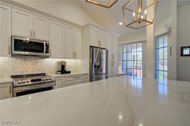 kitchen featuring light stone counters, recessed lighting, decorative backsplash, appliances with stainless steel finishes, and white cabinetry