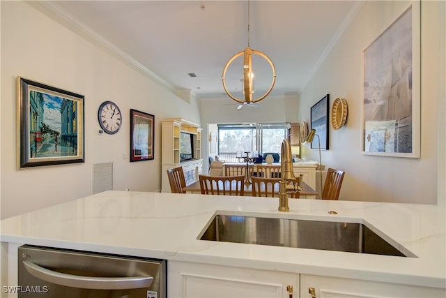 kitchen with visible vents, dishwasher, open floor plan, crown molding, and a sink