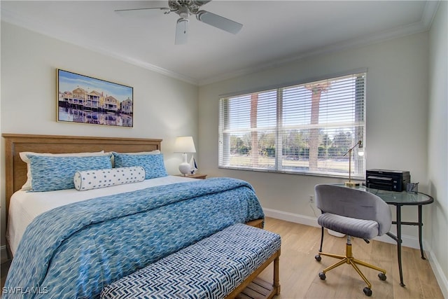 bedroom featuring baseboards, wood finished floors, a ceiling fan, and crown molding