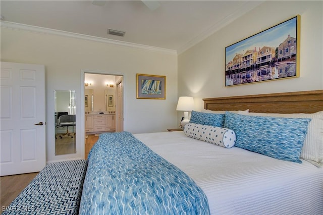 bedroom with visible vents, connected bathroom, ceiling fan, ornamental molding, and wood finished floors