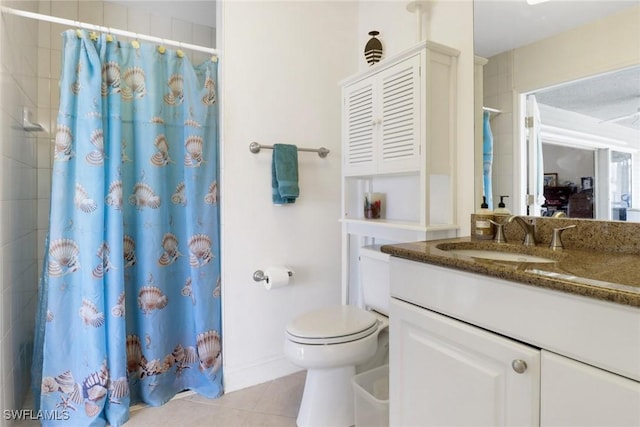 bathroom with a shower with shower curtain, vanity, toilet, and tile patterned floors