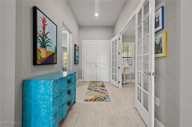 interior space with french doors and baseboards