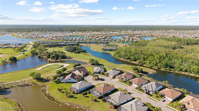 aerial view with a residential view, golf course view, and a water view