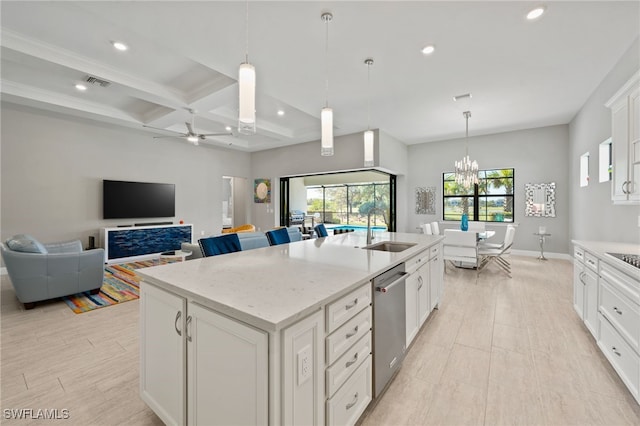 kitchen with visible vents, coffered ceiling, an island with sink, a sink, and stainless steel dishwasher