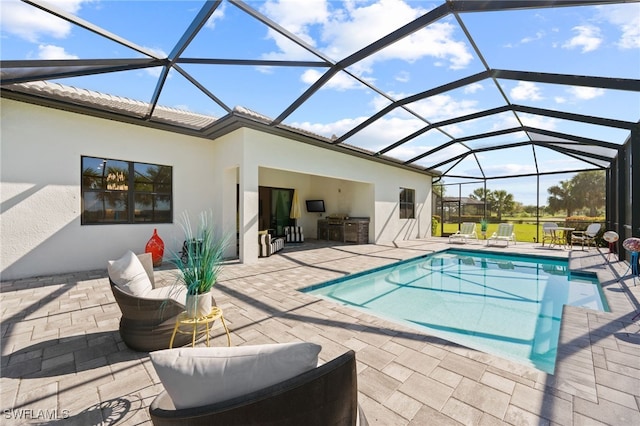 pool with glass enclosure and a patio