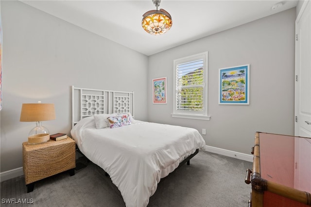 carpeted bedroom with baseboards