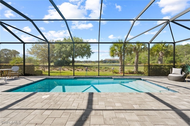 outdoor pool featuring a lanai and a patio area