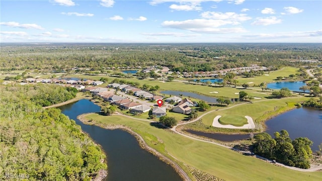 birds eye view of property featuring view of golf course, a forest view, and a water view