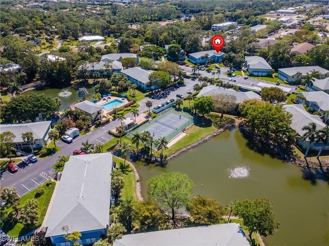 drone / aerial view with a residential view and a water view
