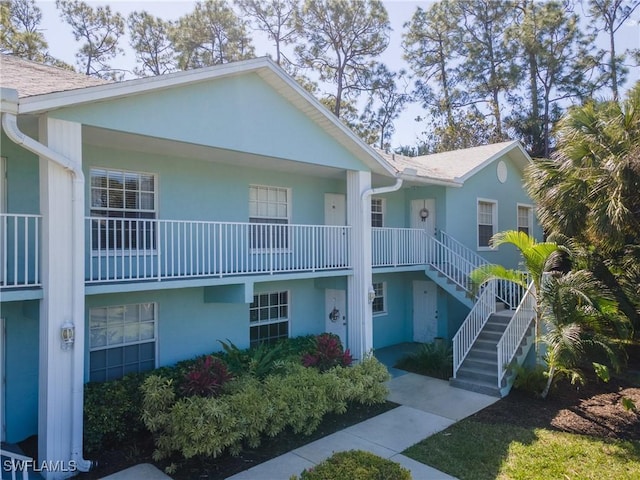 view of property featuring stairs