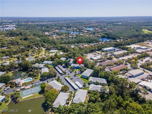 drone / aerial view with a residential view and a water view