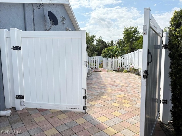 view of gate featuring fence