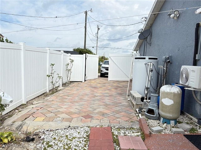 view of patio / terrace featuring ac unit and fence