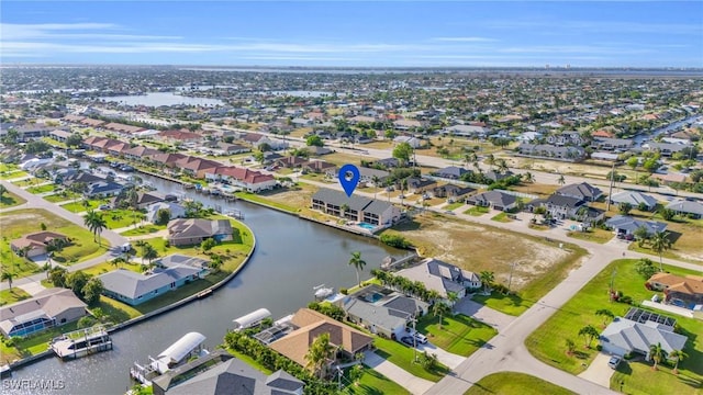 aerial view featuring a water view and a residential view