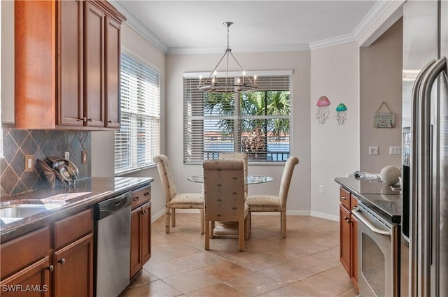 kitchen featuring brown cabinets, ornamental molding, stainless steel appliances, and decorative backsplash