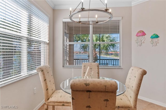 dining room with baseboards, a chandelier, crown molding, and tile patterned floors