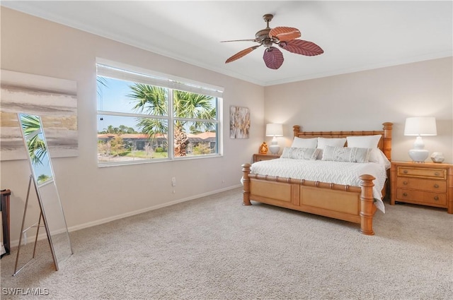 bedroom featuring carpet, crown molding, baseboards, and ceiling fan