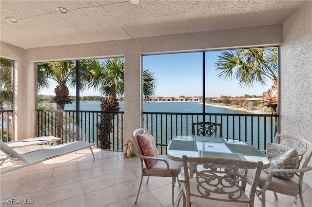 sunroom with a water view