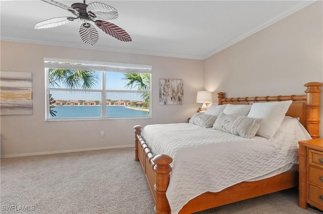 bedroom with light carpet, baseboards, ornamental molding, and ceiling fan