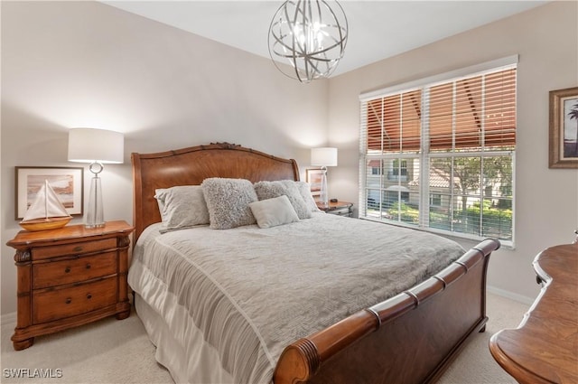 bedroom with a chandelier, light carpet, and baseboards