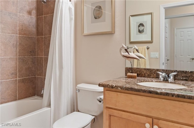 full bathroom featuring shower / bath combo with shower curtain, vanity, and toilet