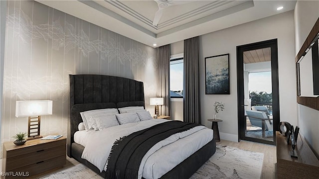 bedroom featuring baseboards, light wood-style floors, and access to outside