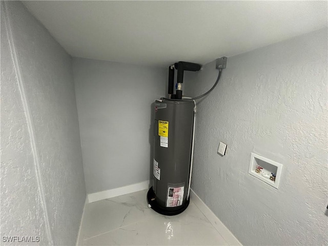 utility room featuring water heater