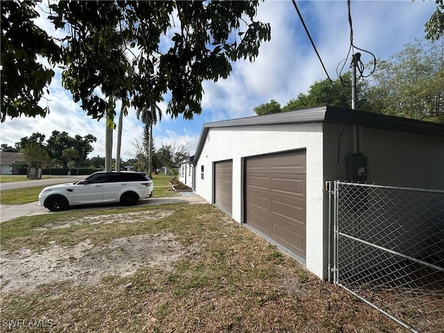 garage featuring driveway